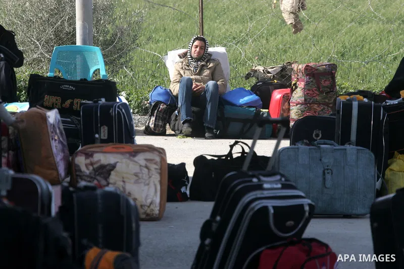 Palestinians wait to cross the Rafah border crossing in the southern Gaza Strip into Egypt on Feb. 22, 2012. Maher Abu Sabha, Director General of the crossings in the Gaza government resign from office an Interior Minist...