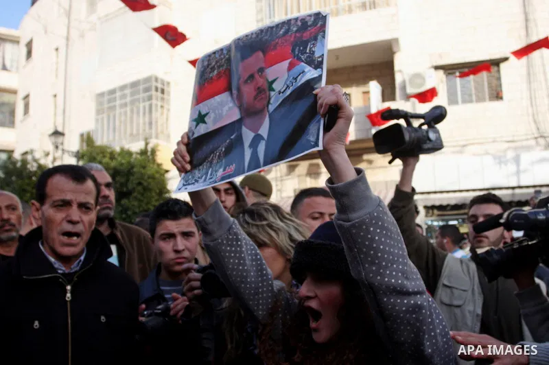 Dozens of Palestinian supporters of Syrian President Bashar al-Assad's clash with dozens of people against the Assad regime in the West Bank city of Ramallah, on February 22, 2012, forcing the police to intervene to sepa...