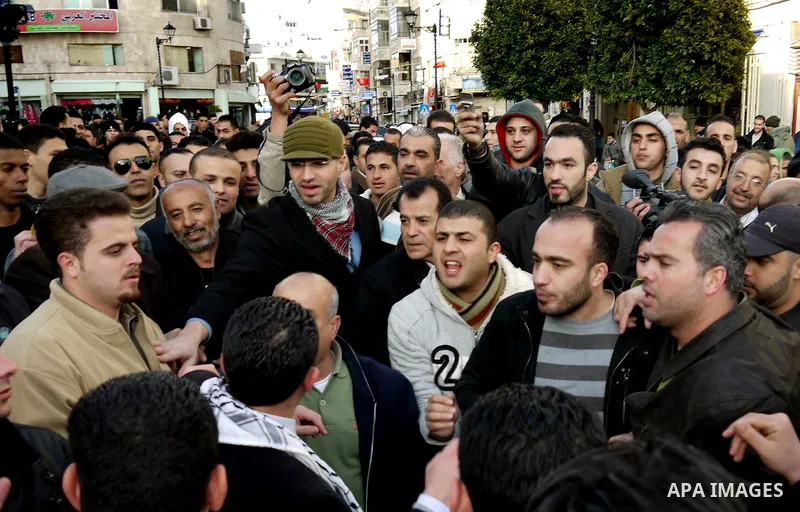 Dozens of Palestinian supporters of Syrian President Bashar al-Assad's clash with dozens of people against the Assad regime in the West Bank city of Ramallah, on February 22, 2012, forcing the police to intervene to sepa...