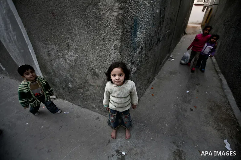 Palestinian children play in the streets of the Jabaliya refugee camp, northern Gaza Strip, 22 February 2012. The United Nations Relief and Works Agency (UNRWA) states that the Israeli blockade on Gaza has made life more...