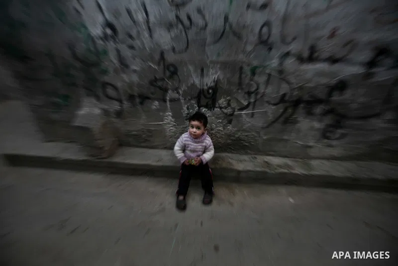 Palestinian children play in the streets of the Jabaliya refugee camp, northern Gaza Strip, 22 February 2012. The United Nations Relief and Works Agency (UNRWA) states that the Israeli blockade on Gaza has made life more...