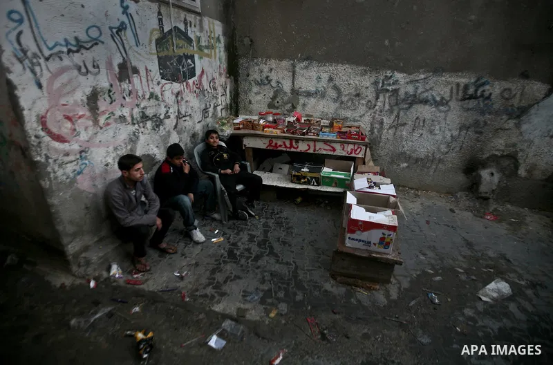 Palestinians sells vegetables on a market in the Jabaliya refugee camp, northern Gaza Strip, 22 February 2012. The United Nations Relief and Works Agency (UNRWA) states that the Israeli blockade on Gaza has made life mor...