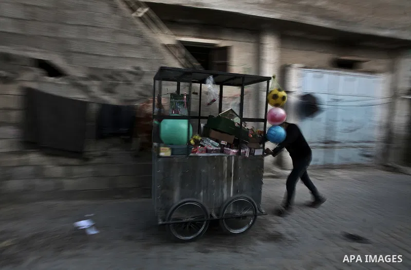Palestinians sells vegetables on a market in the Jabaliya refugee camp, northern Gaza Strip, 22 February 2012. The United Nations Relief and Works Agency (UNRWA) states that the Israeli blockade on Gaza has made life mor...
