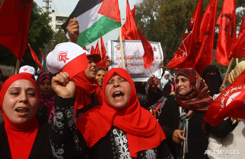 Supporters of the Democratic Front for the Liberation of Palestine (DFLP) shout slogans during a rally marking the 43rd anniversary of the movement's establishment in Gaza City on February 23, 2012. Photo by Ashraf Amra