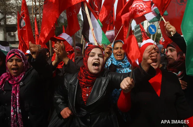 Supporters of the Democratic Front for the Liberation of Palestine (DFLP) shout slogans during a rally marking the 43rd anniversary of the movement's establishment in Gaza City on February 23, 2012. Photo by Ashraf Amra