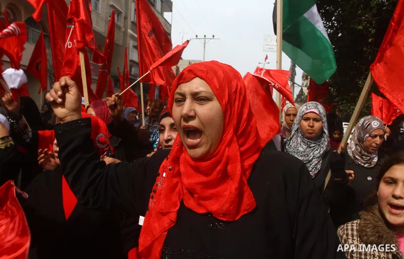 Supporters of the Democratic Front for the Liberation of Palestine (DFLP) shout slogans during a rally marking the 43rd anniversary of the movement's establishment in Gaza City on February 23, 2012. Photo by Ashraf Amra