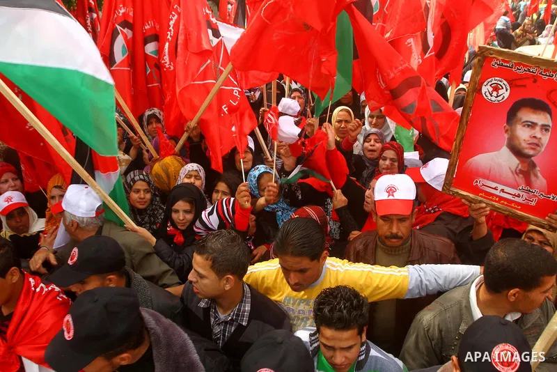 Supporters of the Democratic Front for the Liberation of Palestine (DFLP) shout slogans during a rally marking the 43rd anniversary of the movement's establishment in Gaza City on February 23, 2012. Photo by Ashraf Amra