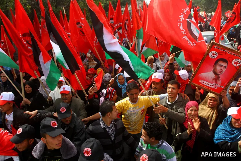Supporters of the Democratic Front for the Liberation of Palestine (DFLP) shout slogans during a rally marking the 43rd anniversary of the movement's establishment in Gaza City on February 23, 2012. Photo by Ashraf Amra