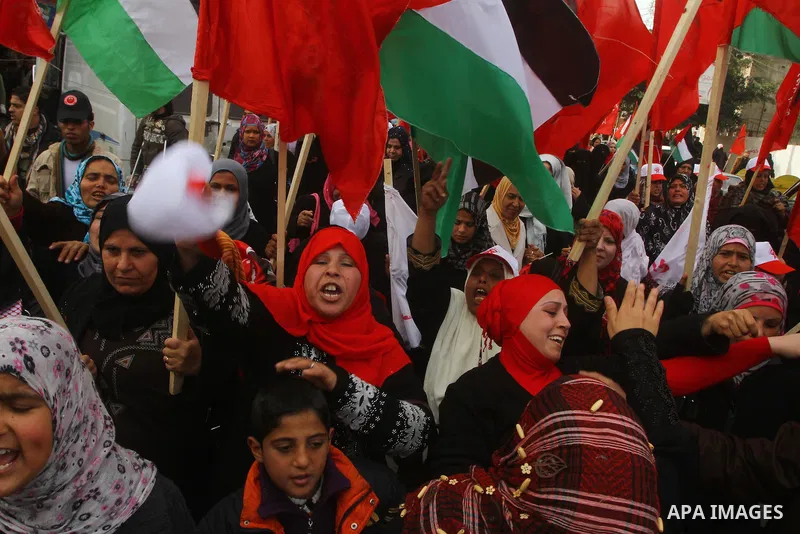 Supporters of the Democratic Front for the Liberation of Palestine (DFLP) shout slogans during a rally marking the 43rd anniversary of the movement's establishment in Gaza City on February 23, 2012. Photo by Ashraf Amra