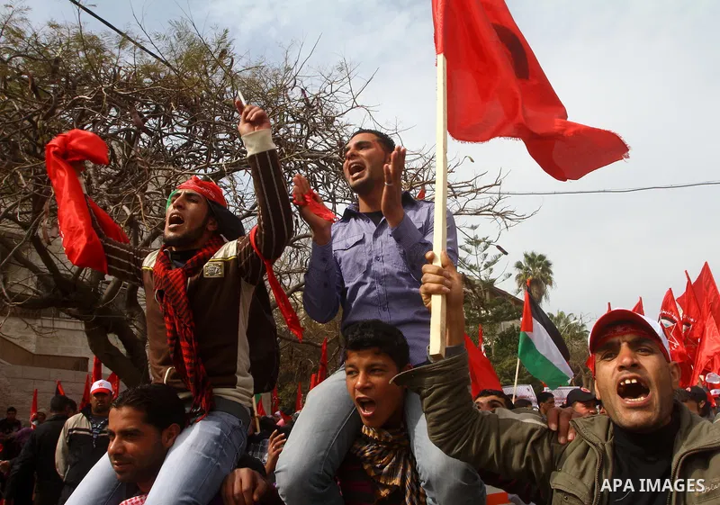 Supporters of the Democratic Front for the Liberation of Palestine (DFLP) shout slogans during a rally marking the 43rd anniversary of the movement's establishment in Gaza City on February 23, 2012. Photo by Ashraf Amra