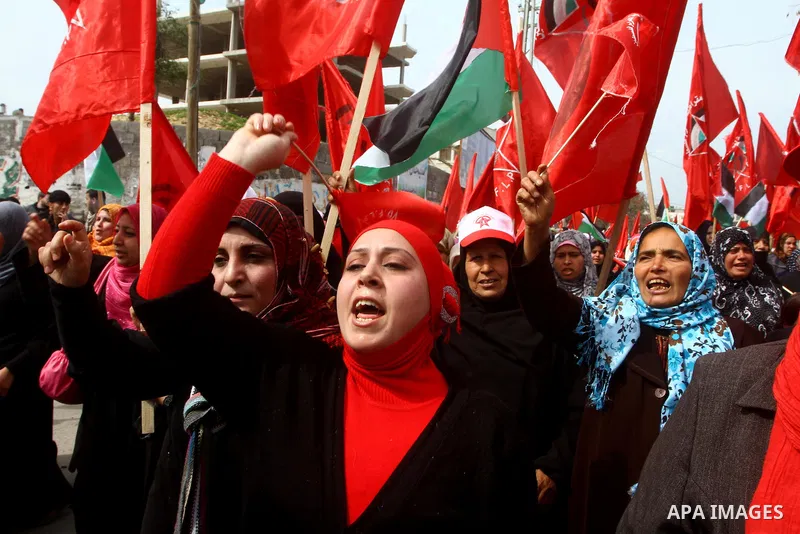 Supporters of the Democratic Front for the Liberation of Palestine (DFLP) shout slogans during a rally marking the 43rd anniversary of the movement's establishment in Gaza City on February 23, 2012. Photo by Ashraf Amra
