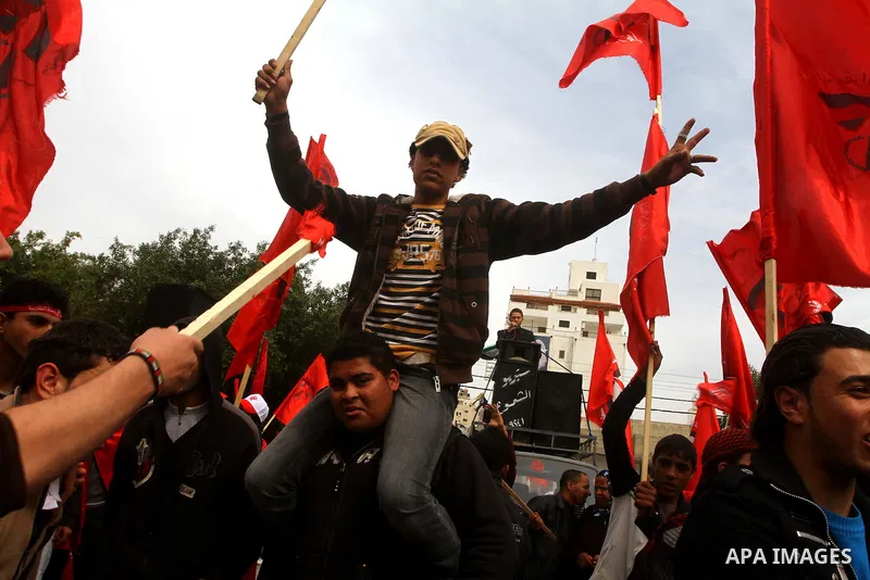 Supporters of the Democratic Front for the Liberation of Palestine (DFLP) shout slogans during a rally marking the 43rd anniversary of the movement's establishment in Gaza City on February 23, 2012. Photo by Ashraf Amra