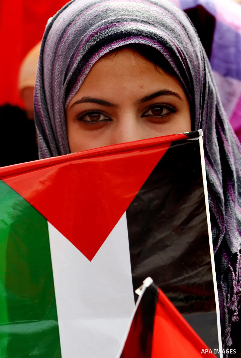 Supporters of the Democratic Front for the Liberation of Palestine (DFLP) shout slogans during a rally marking the 43rd anniversary of the movement's establishment in Gaza City on February 23, 2012. Photo by Ashraf Amra