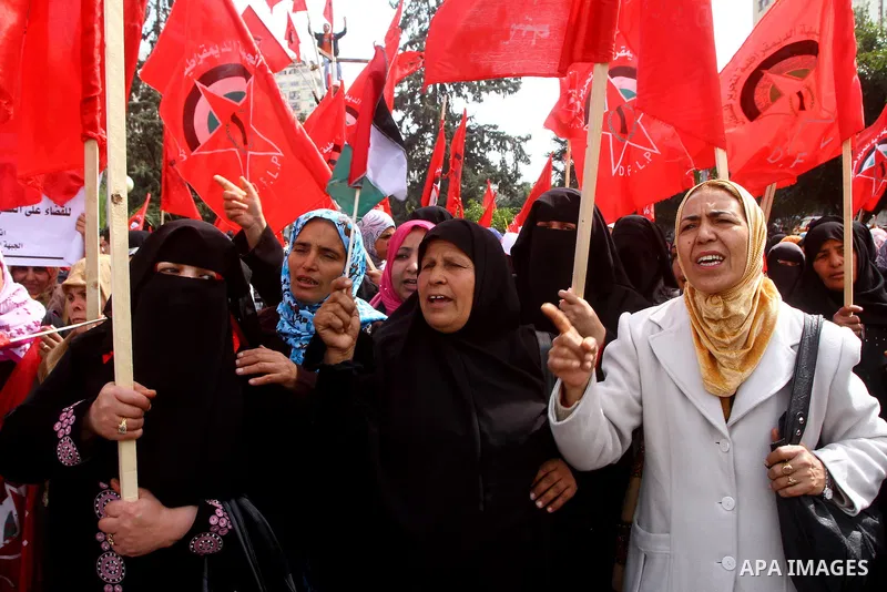 Supporters of the Democratic Front for the Liberation of Palestine (DFLP) shout slogans during a rally marking the 43rd anniversary of the movement's establishment in Gaza City on February 23, 2012. Photo by Ashraf Amra