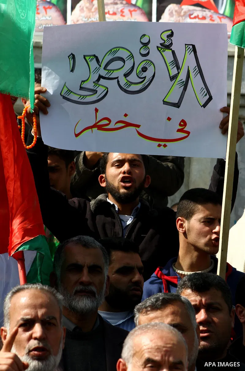 Palestinian protesters shout slogans during a demonstration in Gaza City on February 23, 2012 against the arrest of three Palestinians in Jerusalem's old city that houses the Al-Aqsa mosque compound after confrontations...