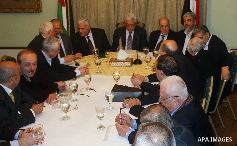Egyptian intelligence chief Murad Muwafi, Palestinian President Mahmoud Abbas, and Hamas leader Khaled Meshaal, during a meeting between Fatah and Hamas in Cairo, Egypt, 23 February 2012. According to media reports, the...