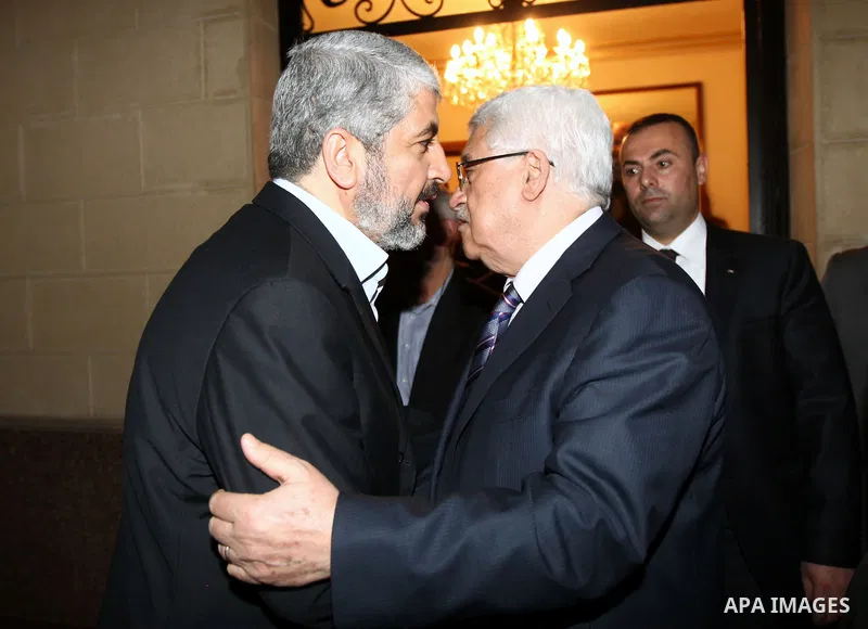 Palestinian President Mahmud Abbas meets with Palestinian Hamas leader, Khaleed Meshaal in Cairo on February 23,2012, to implement the terms of a reconciliation deal they signed in the Egyptian capital in May, which call...