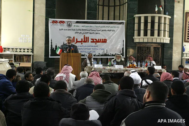 Palestinian legislative council members and members of Kuwaiti delegation attend the opening ceremony of al-Abrar mosque, which was destroyed during the Israeli war on Gaza Strip in 2008-2009, in the southern Gaza Strip...
