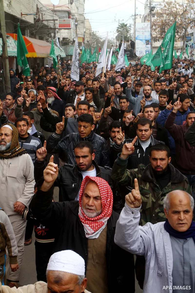 Palestinian protesters shout slogans as they gather in Khan Yunis in the southern Gaza Strip on February 24, 2012 during a demonstration to show solidarity for Jerusalem's Al-Aqsa mosque compound. Clashes briefly broke o...