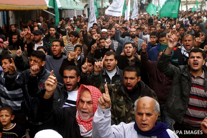 Palestinian protesters shout slogans as they gather in Khan Yunis in the southern Gaza Strip on February 24, 2012 during a demonstration to show solidarity for Jerusalem's Al-Aqsa mosque compound. Clashes briefly broke o...