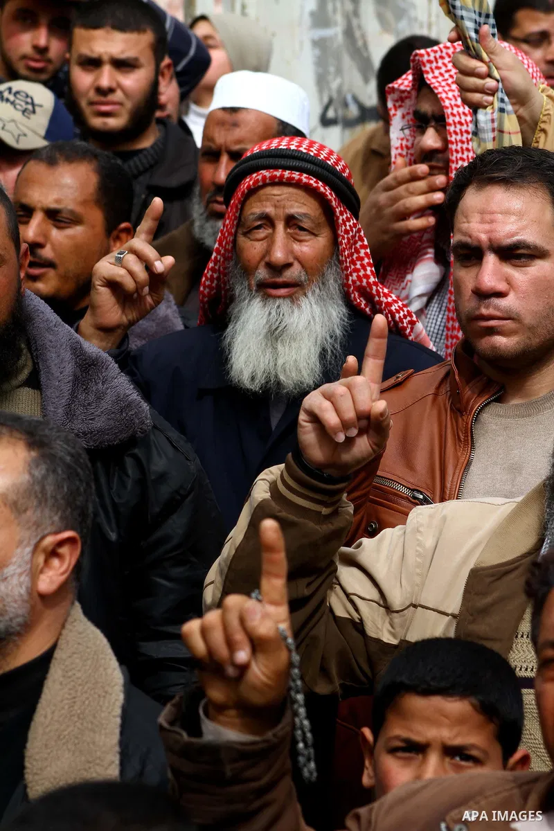 Palestinian protesters shout slogans as they gather in Khan Yunis in the southern Gaza Strip on February 24, 2012 during a demonstration to show solidarity for Jerusalem's Al-Aqsa mosque compound. Clashes briefly broke o...