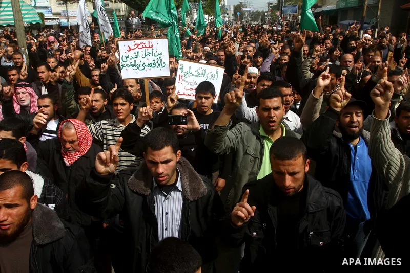 Palestinian protesters shout slogans as they gather in Khan Yunis in the southern Gaza Strip on February 24, 2012 during a demonstration to show solidarity for Jerusalem's Al-Aqsa mosque compound. Clashes briefly broke o...