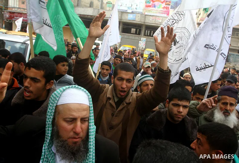 Palestinian protesters shout slogans as they gather in Khan Yunis in the southern Gaza Strip on February 24, 2012 during a demonstration to show solidarity for Jerusalem's Al-Aqsa mosque compound. Clashes briefly broke o...