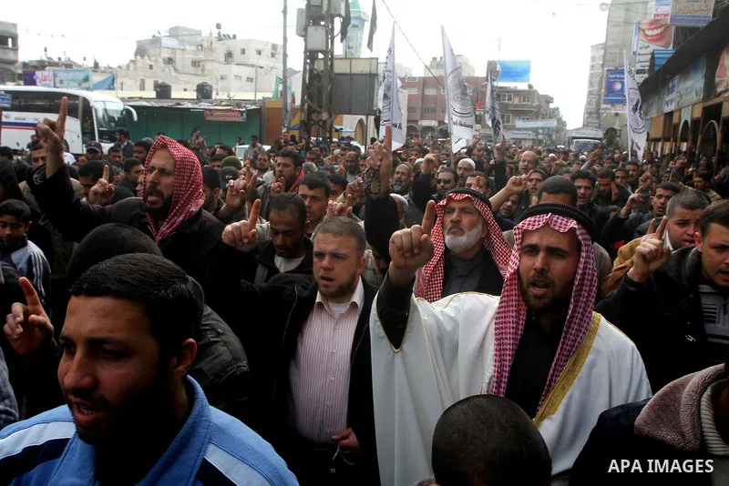Palestinian protesters shout slogans as they gather in Khan Yunis in the southern Gaza Strip on February 24, 2012 during a demonstration to show solidarity for Jerusalem's Al-Aqsa mosque compound. Clashes briefly broke o...
