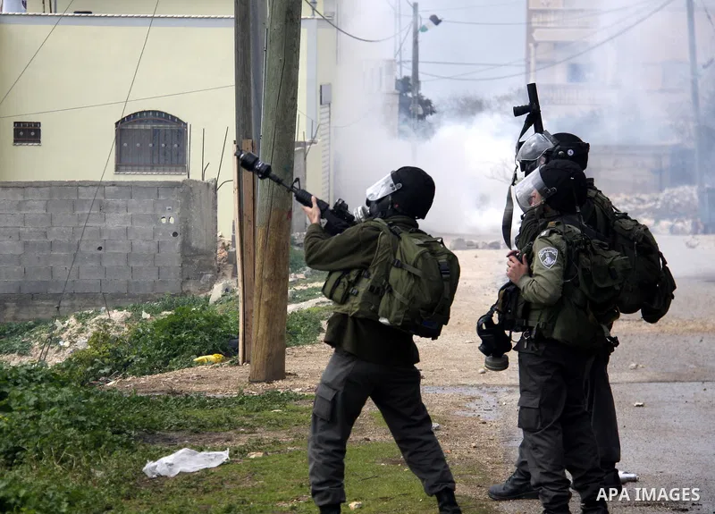 Palestinian protesters clash with Israeli soldiers during a demonstration against the expropriation of Palestinian land by Israel in the village of Kfar Qaddum, near the West Bank city of Nablus, on February 24, 2012. Ph...