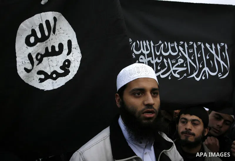 Palestinian Salafists take part in a protest against Syria's President Bashar al-Assad in Rafah in the southern Gaza Strip February 24, 2012. The black flag reads "There is no god but Allah and Mohammad is the prophet"....