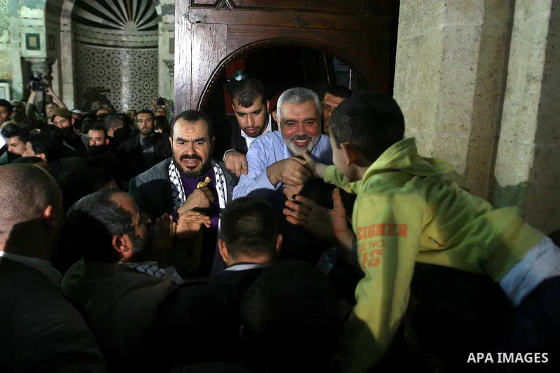 Palestinian prime minister in Gaza Strip, Ismail Haniya greets supporters as he leaves following Friday noon prayer at Al-Azhar mosque, in Cairo, Egypt, 24 February 2012. According to media reports, Haniyeh joined hundre...