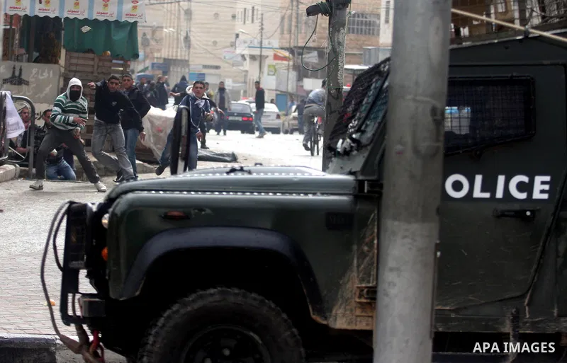 Palestinians protesters clash with Israeli soldiers during a demonstration commemorating 18 years to the Hebron massacre and calling to open Shuhada street in the West Bank city of Hebron, Friday, Feb. 24, 2012. In 1994,...