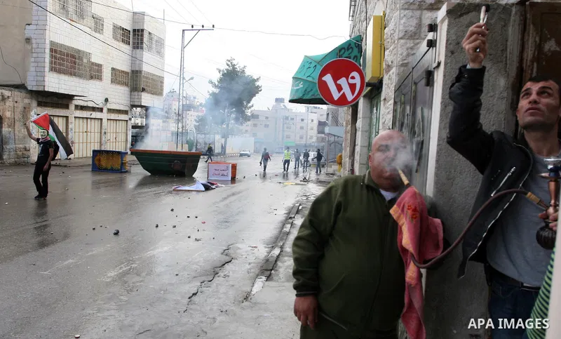 Palestinians protesters clash with Israeli soldiers during a demonstration commemorating 18 years to the Hebron massacre and calling to open Shuhada street in the West Bank city of Hebron, Friday, Feb. 24, 2012. In 1994,...