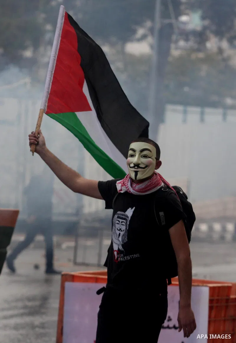 Palestinians protesters clash with Israeli soldiers during a demonstration commemorating 18 years to the Hebron massacre and calling to open Shuhada street in the West Bank city of Hebron, Friday, Feb. 24, 2012. In 1994,...