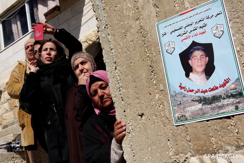 Palestinian women mourn the death of Talaat Rameya during his funeral procession in the town of Al-Ram on the outskirts of Jerusalem on February 25, 2012. Rameya was killed in one of a string of clashes on February 24 be...