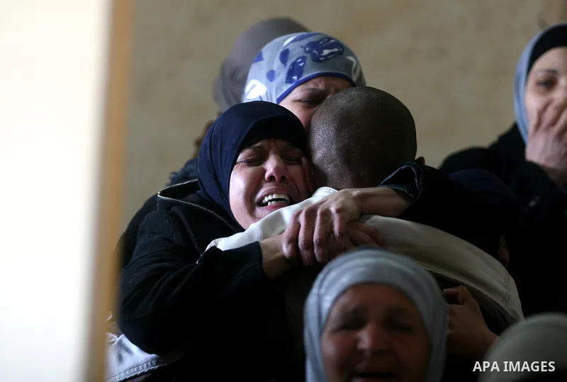 Palestinian women mourn the death of Talaat Rameya during his funeral procession in the town of Al-Ram on the outskirts of Jerusalem on February 25, 2012. Rameya was killed in one of a string of clashes on February 24 be...
