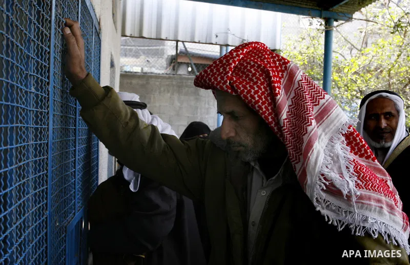 Palestinians receive their monthly food aid at a UN distribution center in the Rafah refugee camp, southern Gaza Strip on February 26, 2012. Photo by Abed Rahim Khatib