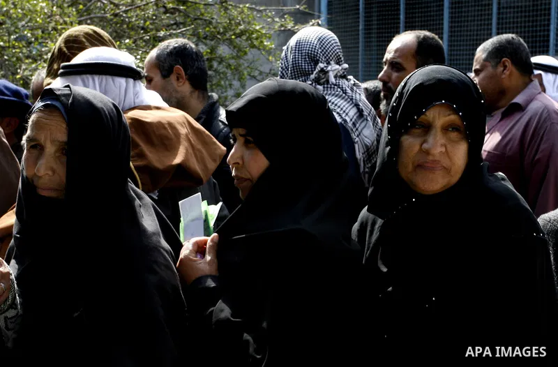 Palestinians receive their monthly food aid at a UN distribution center in the Rafah refugee camp, southern Gaza Strip on February 26, 2012. Photo by Abed Rahim Khatib