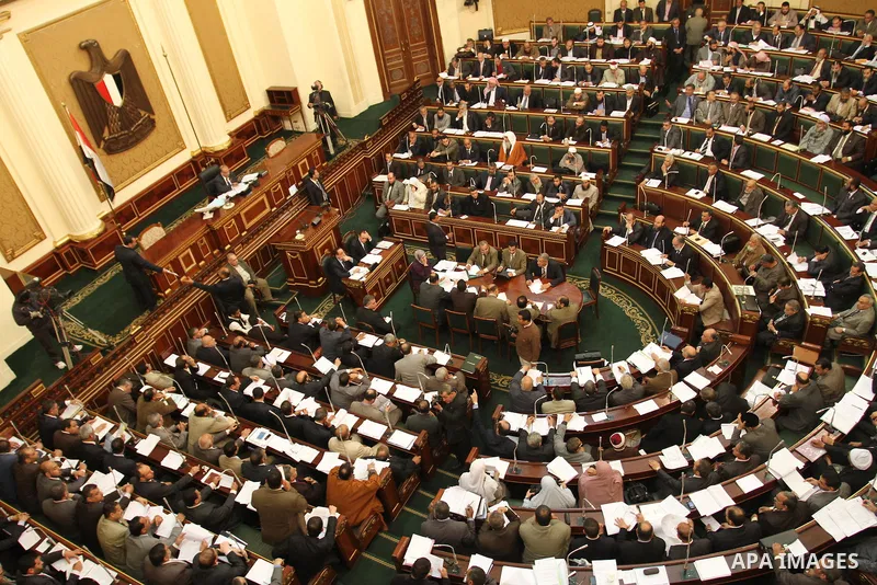 Egypt's army-appointed Prime Minister Kamal al-Ganzouri speaks during a parliament session in Cairo February 26, 2012. Egypt's military rulers invited the parliament's two houses to convene on Saturday to elect an assemb...