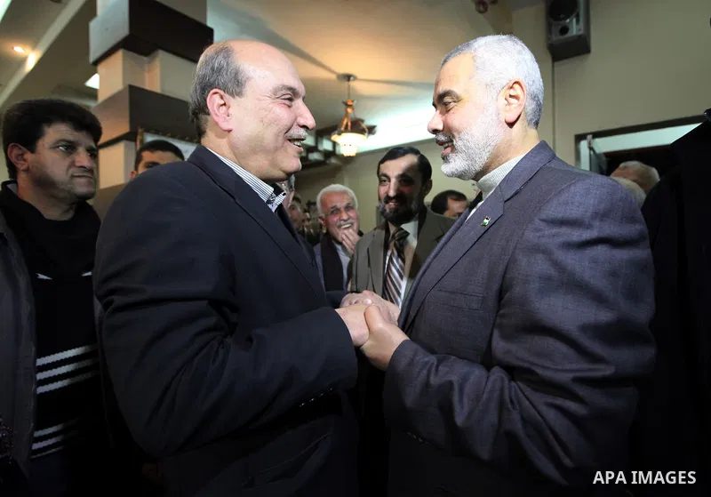 Palestinian Prime Minister in Gaza Strip, Ismail Haniyeh, receives Official Popular Front in the outside Maher al-Taher, in Gaza City on Feb. 27, 2012. Photo by Mohammed Ostaz