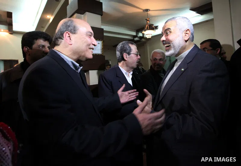 Palestinian Prime Minister in Gaza Strip, Ismail Haniyeh, receives Official Popular Front in the outside Maher al-Taher, in Gaza City on Feb. 27, 2012. Photo by Mohammed Ostaz