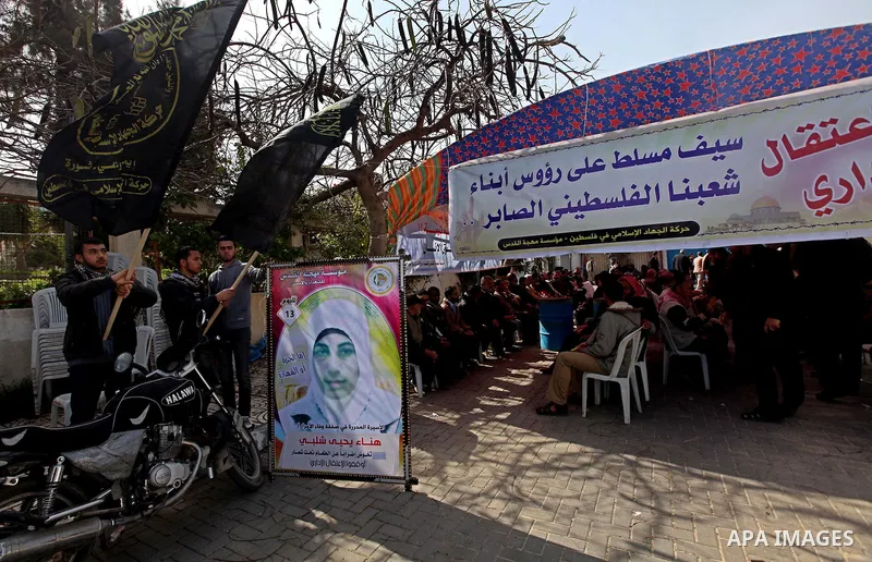 A picture of Palestinian prisoner Hana'a Shalabi stands outside a protest tent outside the United Nations building in Gaza City on February 28, 2012. Shalabi, released by Israel in a prisoner swap last year but re-arrest...
