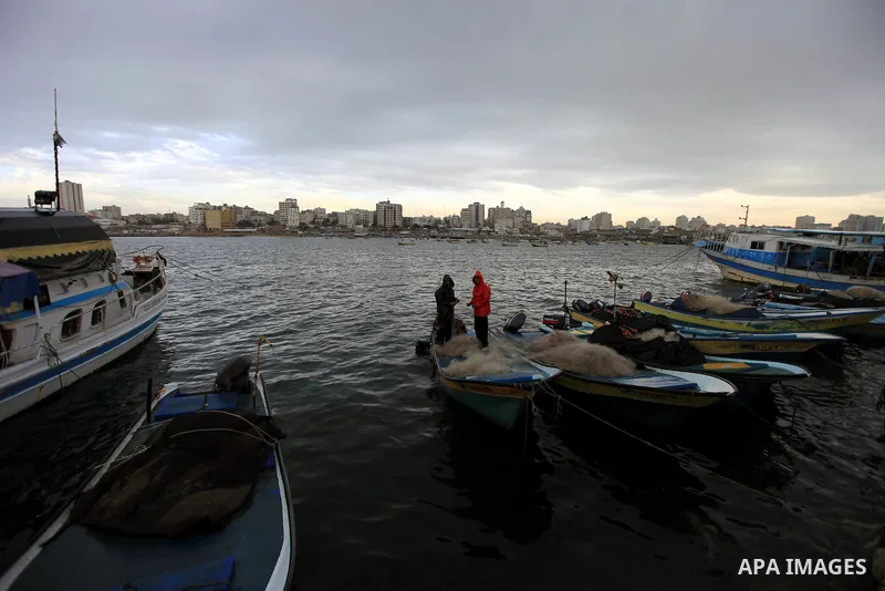 Palestinian fishermen work on the beach in Gaza City, on Feb. 28, 2012. Photo by Wisam Nassar