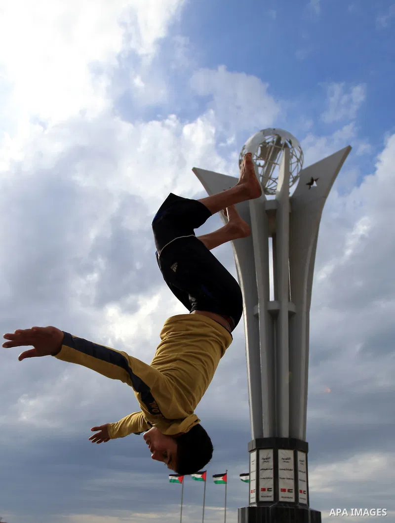 A Palestinian boy enjoys practicing jump on the beach in Gaza City, on Feb. 28, 2012. Photo by Wisam Nassar