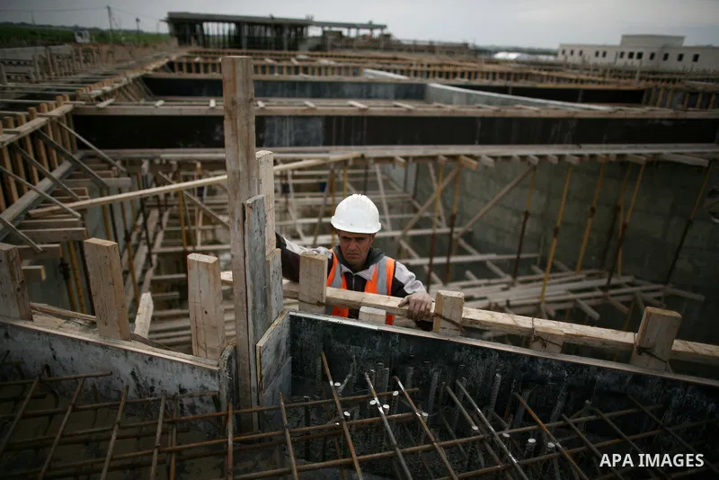 Palestinian workers work in building a sewage desalination station in the Northern Gaza Strip on Feb. 26, 2012. The Sewage desalination project is funded by the International Bank and EU with budget 40 million dollar. Th...