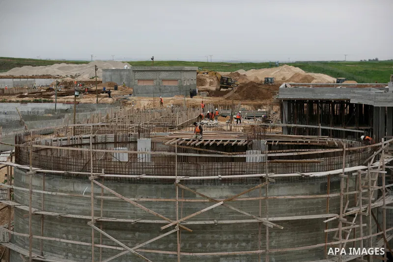 Palestinian workers work in building a sewage desalination station in the Northern Gaza Strip on Feb. 26, 2012. The Sewage desalination project is funded by the International Bank and EU with budget 40 million dollar. Th...