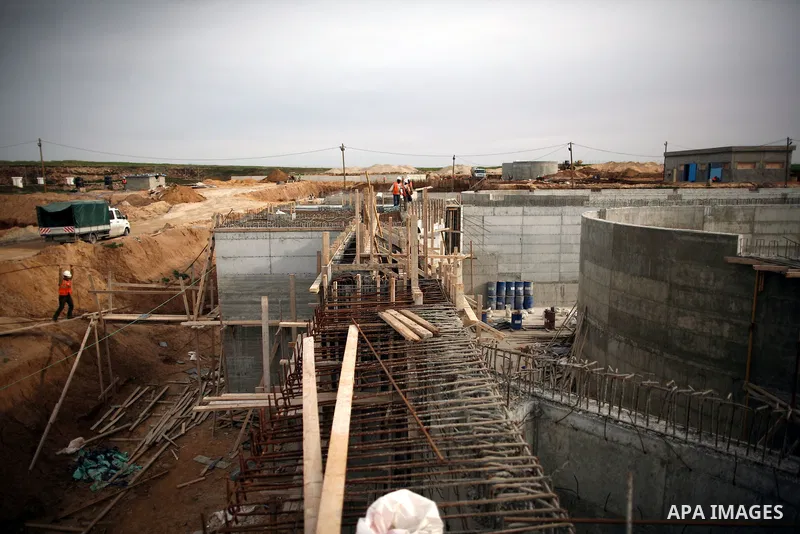 Palestinian workers work in building a sewage desalination station in the Northern Gaza Strip on Feb. 26, 2012. The Sewage desalination project is funded by the International Bank and EU with budget 40 million dollar. Th...