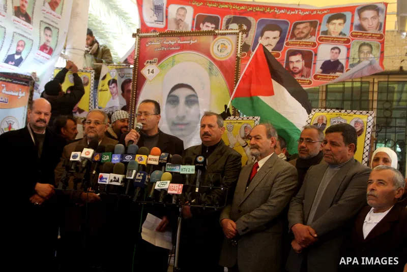 Palestinians speak during press conference while a protest at the Red Cross' offices in Gaza City to call for the release of Palestinian prisoners held in Israeli jails, on Feb. 29, 2012. Photo by Ashraf Amra
