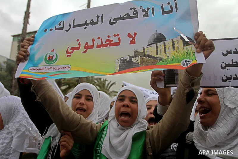 Palestinians female students shout slogans as she and others take part in a protest organized by the Islamic Hamas movement in Gaza city, on February 29, 2012, to show solidarity with Palestinians protesting last week at...