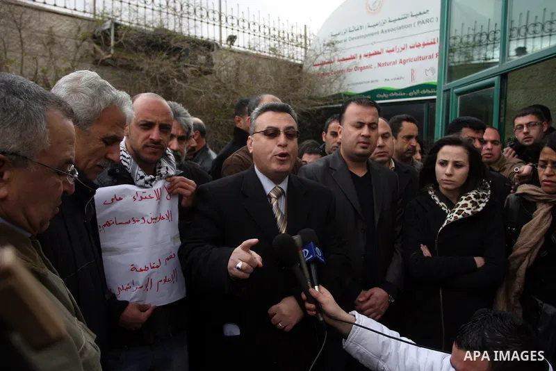 Staff members of a local private television station "Watan",during press conference speaks for the damage caused after Israeli troops raided this and another Palestinian television station in the West Bank city of Ramall...